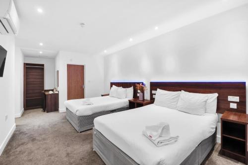 Habitación cuádruple del hotel Signature London. Foto 5