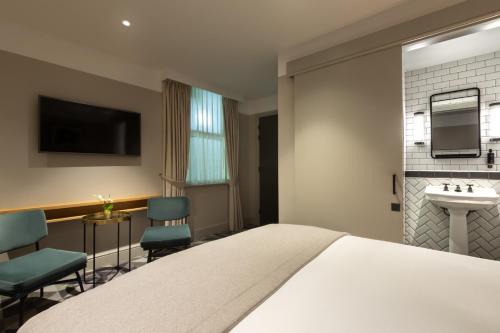 Habitación Doble Deluxe del hotel Victory House London. Foto 4