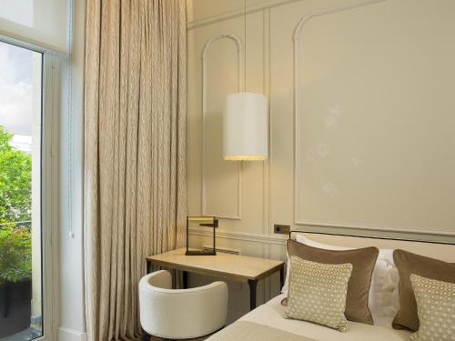 Habitación Doble Clásica del hotel Le Narcisse Blanc and Spa. Foto 3