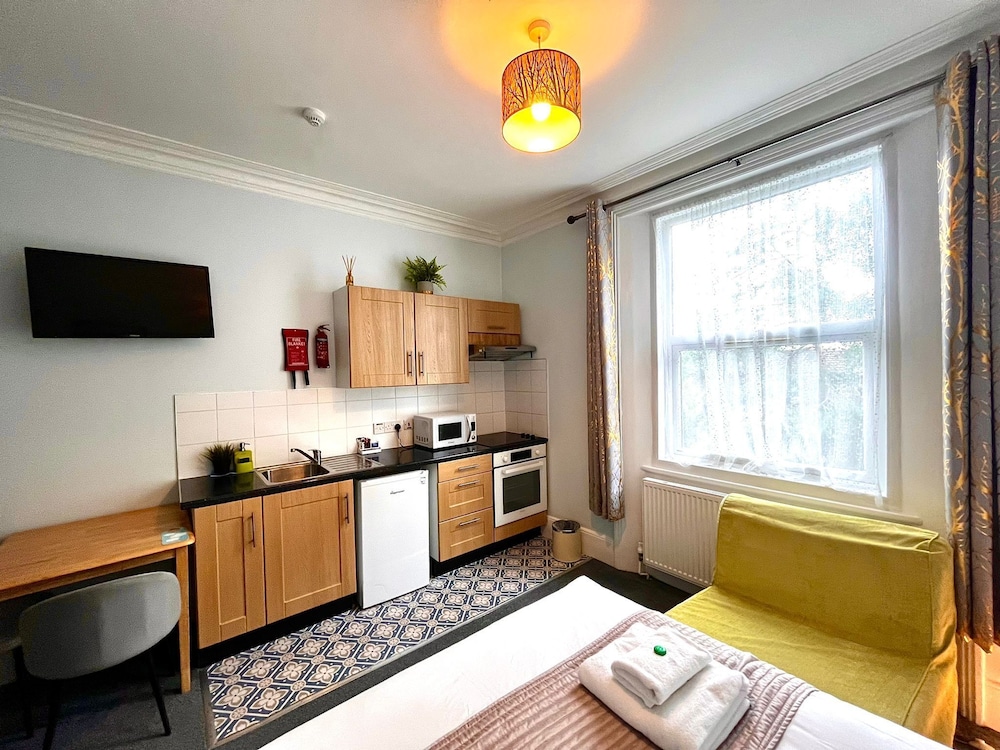 Habitación triple del hotel United Lodge and Apartments