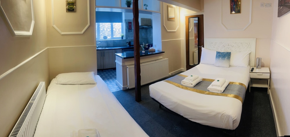 Habitación triple del hotel United Lodge and Apartments. Foto 16