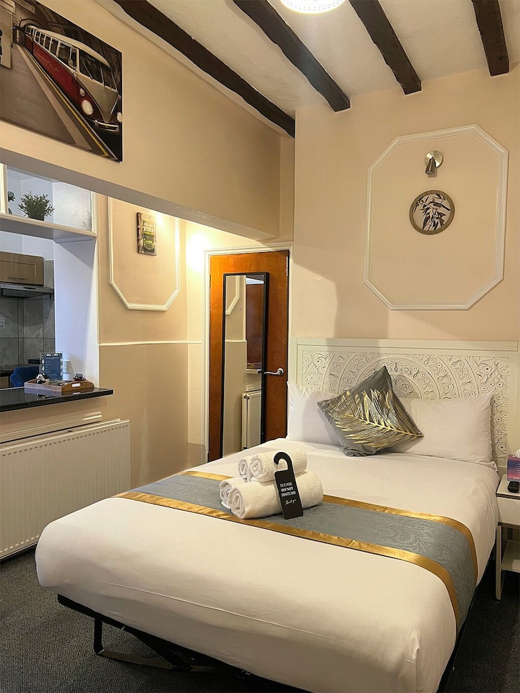 Habitación triple del hotel United Lodge and Apartments. Foto 32