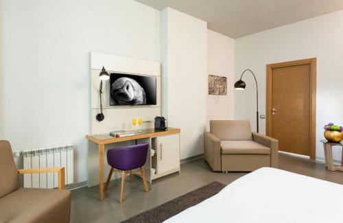 Habitación Doble Deluxe del hotel NYX Milan. Foto 1