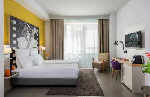 Habitación Doble Deluxe del hotel NYX Milan. Foto 3