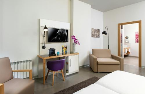 Habitación Doble Deluxe del hotel NYX Milan. Foto 7