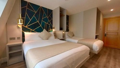 Habitación Triple del hotel NOX Olympia. Foto 12