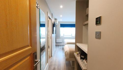 Habitación Triple del hotel NOX Olympia. Foto 14