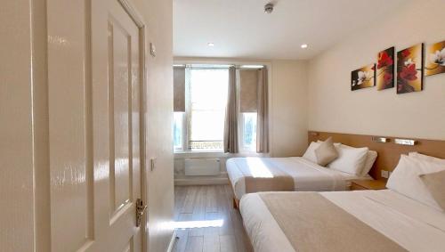 Family Room, 2 Double Beds del hotel NOX Olympia. Foto 2