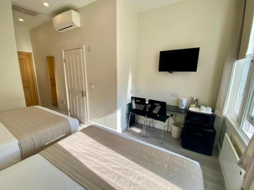 Family Room, 2 Double Beds del hotel NOX Olympia. Foto 5