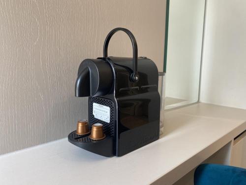 Family Room, 2 Double Beds del hotel NOX Olympia. Foto 7