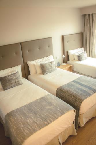 Habitación Triple - No fumadores del hotel Dazzler Asuncion. Foto 3