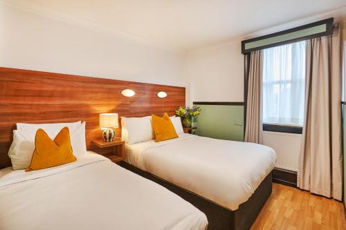 Habitación Triple del hotel Huttons. Foto 6