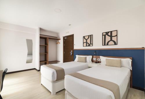 Habitación Doble Deluxe con balcón - 1 o 2 camas del hotel Boutique Roisa