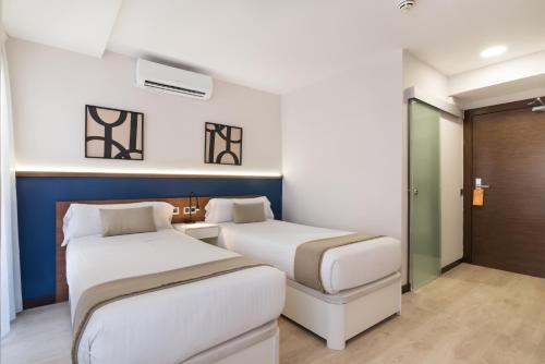 Habitación Doble Deluxe con balcón - 1 o 2 camas del hotel Boutique Roisa. Foto 7
