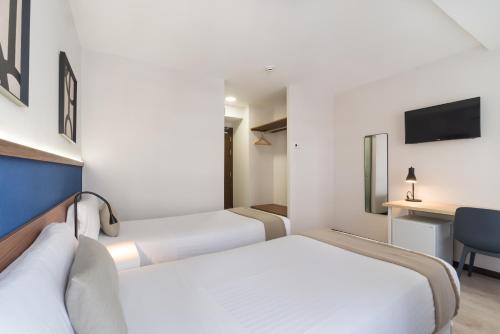 Habitación Doble Deluxe con balcón - 1 o 2 camas del hotel Boutique Roisa. Foto 10