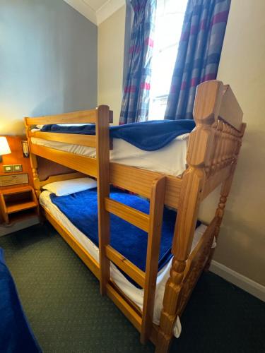 Habitación cuádruple del hotel Beverley House. Foto 11