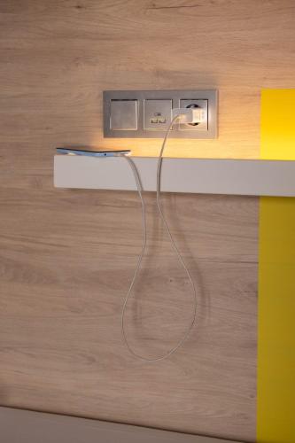 Cama en habitación compartida con 4 camas del hotel U-sense For You Sevilla. Foto 5