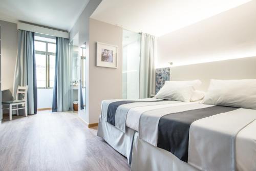 Habitación Deluxe del hotel Sé Boutique. Foto 9