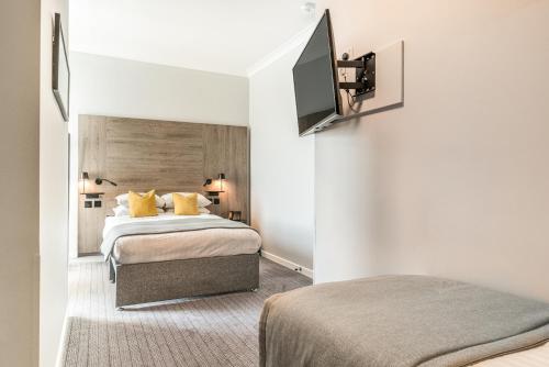 Habitación Triple Estándar del hotel The Princes Square. Foto 13