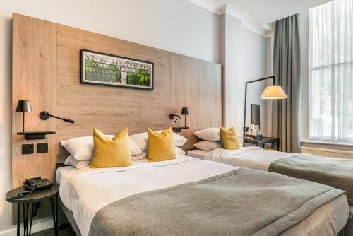 Habitación Triple Estándar del hotel The Princes Square. Foto 18