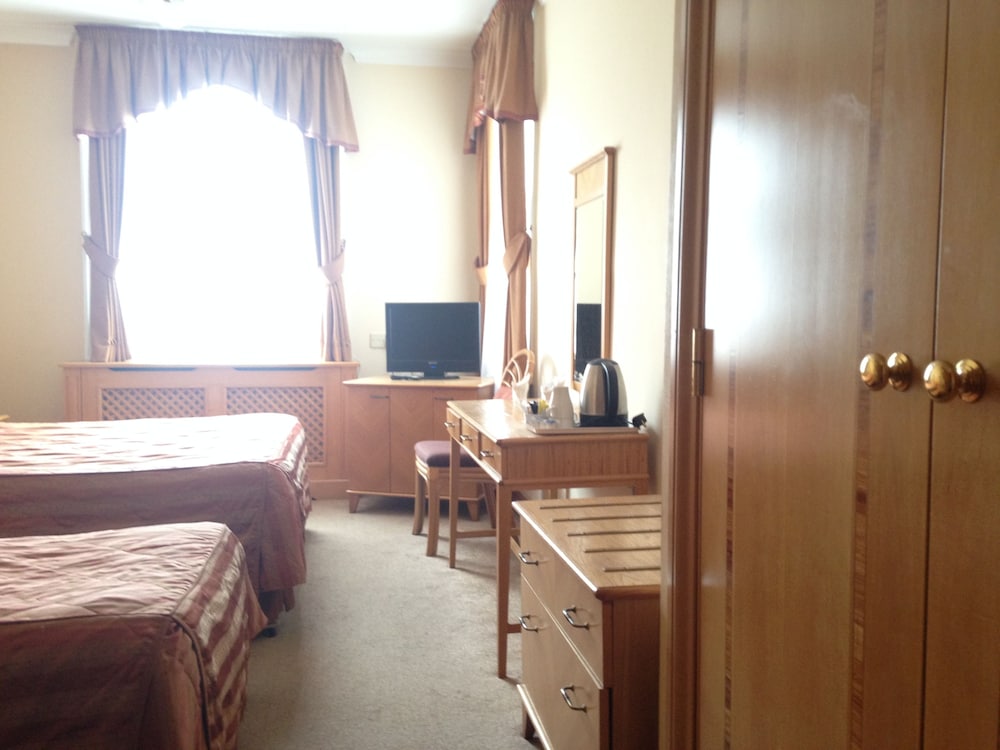 Habitación triple del hotel Troy