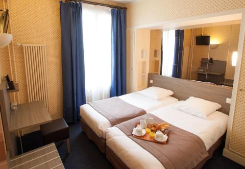 Habitación Doble Estándar - 1 o 2 camas del hotel Eiffel Kensington. Foto 1