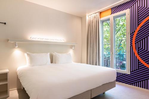 Habitación Triple del hotel Graphik Montparnasse. Foto 1