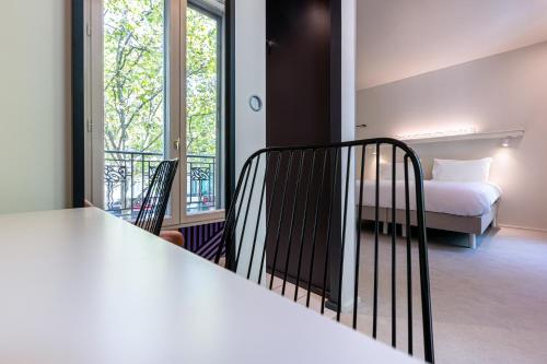 Habitación Triple del hotel Graphik Montparnasse. Foto 2