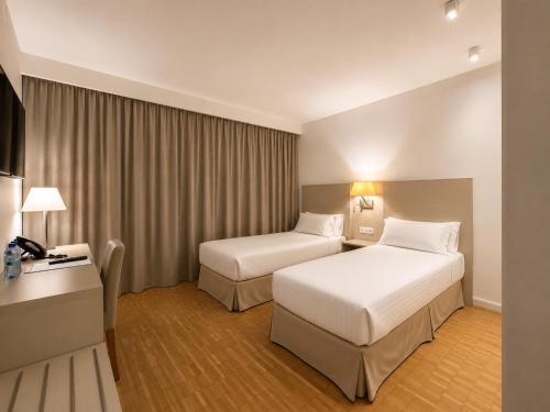 Habitación Doble con balcón - 1 o 2 camas del hotel Lauria. Foto 9