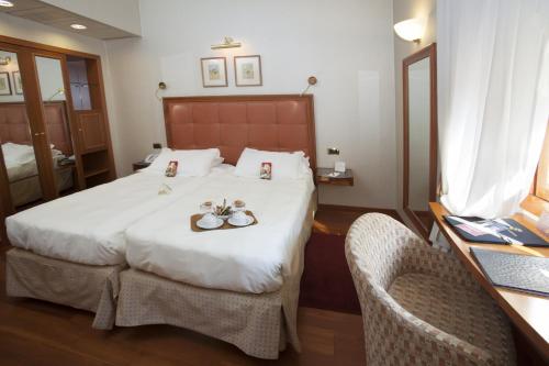 Habitación Doble Quality con cama supletoria - 1 o 2 camas del hotel Berna. Foto 5