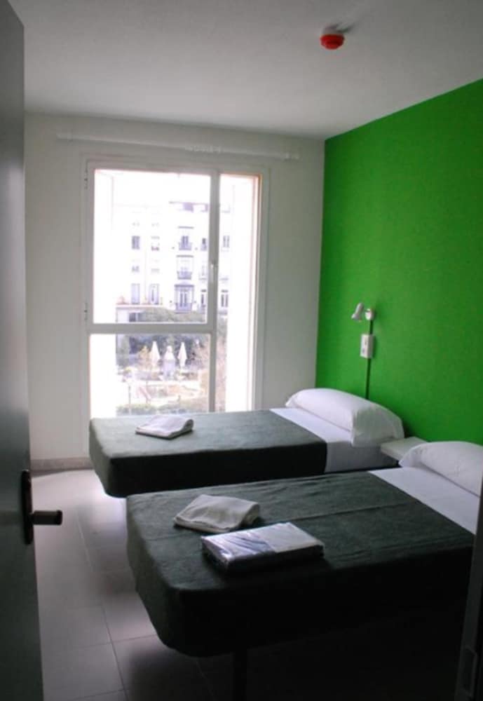 Habitación con 2 camas individuales del hotel Motion Chueca. Foto 2