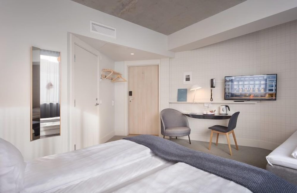 Habitación Triple Estándar del hotel Zander K. Foto 1