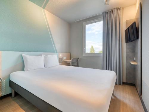 Habitación Doble Estándar del hotel ibis budget Orly Chevilly Tram 7. Foto 5