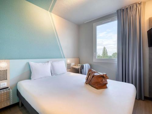Habitación Doble Estándar del hotel ibis budget Orly Chevilly Tram 7. Foto 9