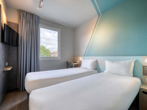 Habitación Doble Estándar - 2 camas del hotel ibis budget Orly Chevilly Tram 7. Foto 3