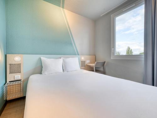 Habitación Doble Estándar del hotel ibis budget Orly Chevilly Tram 7. Foto 13
