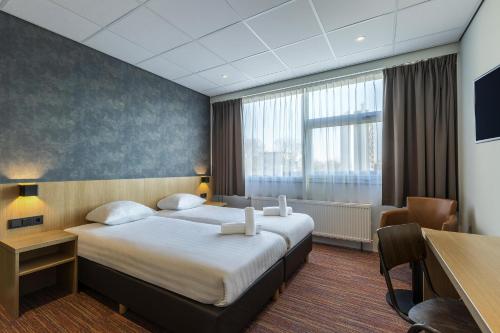 Habitación doble con ducha accesible en silla de ruedas - 2 camas - Adaptada para personas con movilidad reducida del hotel Best Western Amsterdam. Foto 3