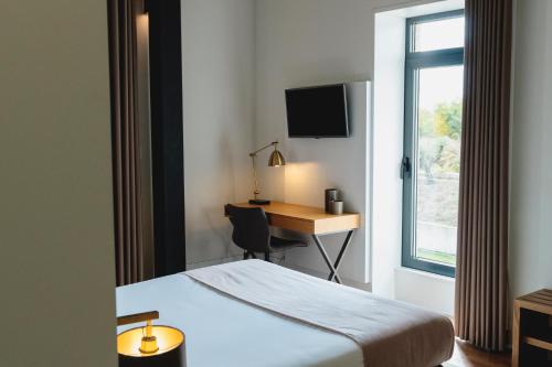 Habitación Doble Deluxe con ducha del hotel Borralha, Restaurante and Spa. Foto 5
