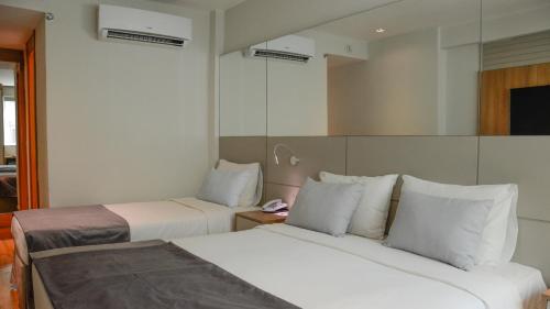 Habitación Triple Deluxe del hotel Atlântico Travel. Foto 5