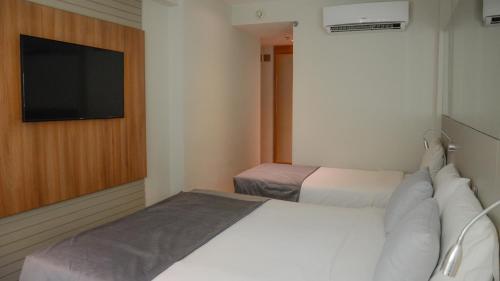 Habitación Triple Deluxe del hotel Atlântico Travel. Foto 6