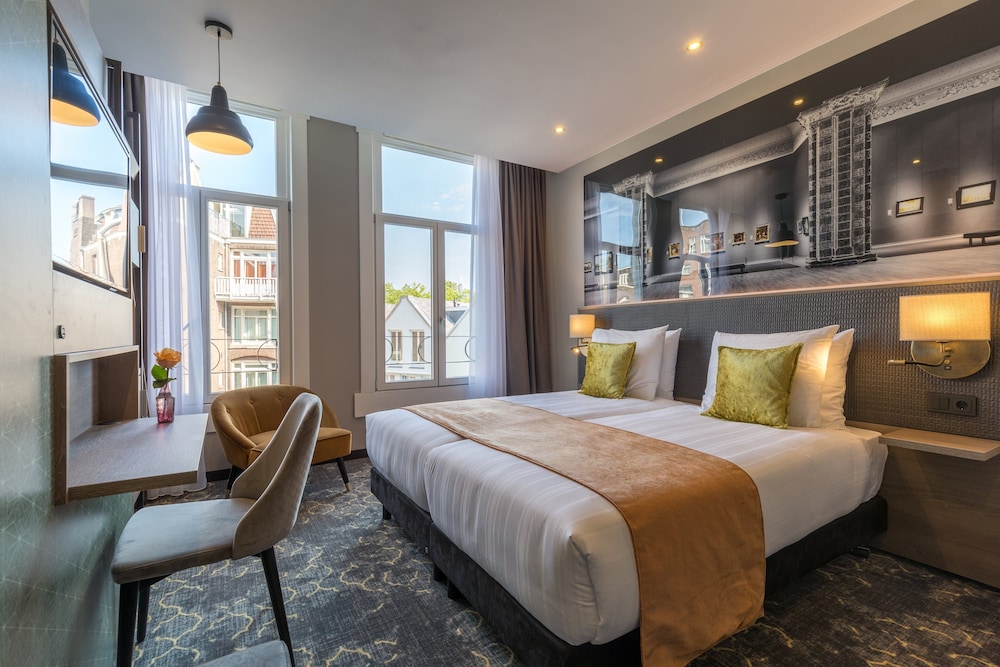 Habitación Deluxe con 2 camas individuales del hotel Leonardo Boutique Museumhotel. Foto 1
