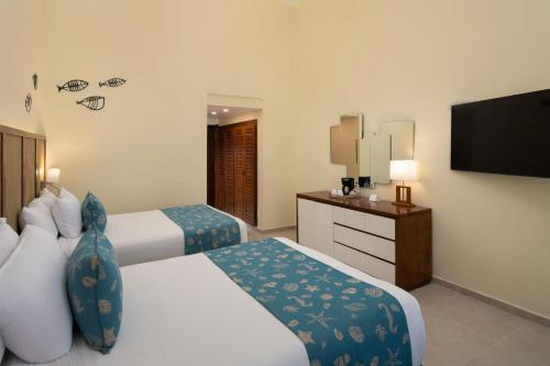 Habitación con vistas tropicales del hotel Impressive Punta Cana. Foto 4