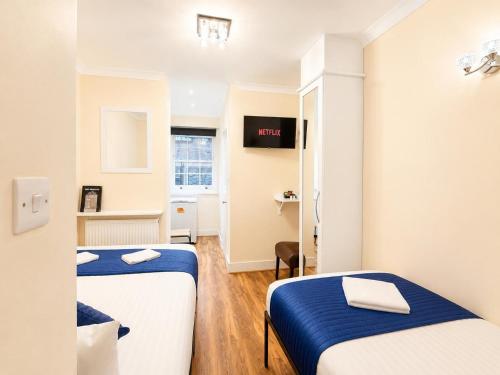 Habitación Triple del hotel King's Cross. Foto 10