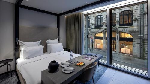 Habitación con vistas a la ciudad - 2 camas del hotel Porto Royal Bridges. Foto 1