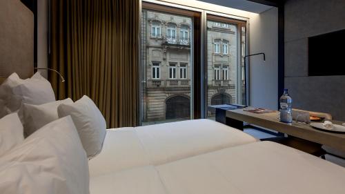 Habitación con vistas a la ciudad - 2 camas del hotel Porto Royal Bridges. Foto 3