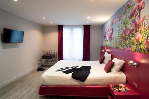 Habitación Doble Deluxe del hotel Les Jardins De Montmartre. Foto 3