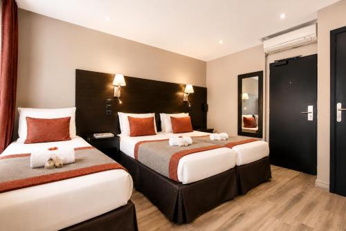 Habitación Cuádruple del hotel Migny Opera Montmartre. Foto 15