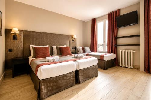 Habitación Triple del hotel Migny Opera Montmartre. Foto 16