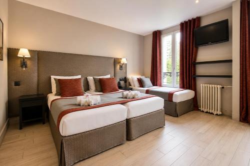 Habitación Cuádruple del hotel Migny Opera Montmartre. Foto 18