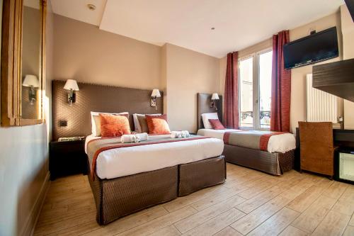 Habitación Triple del hotel Migny Opera Montmartre. Foto 8